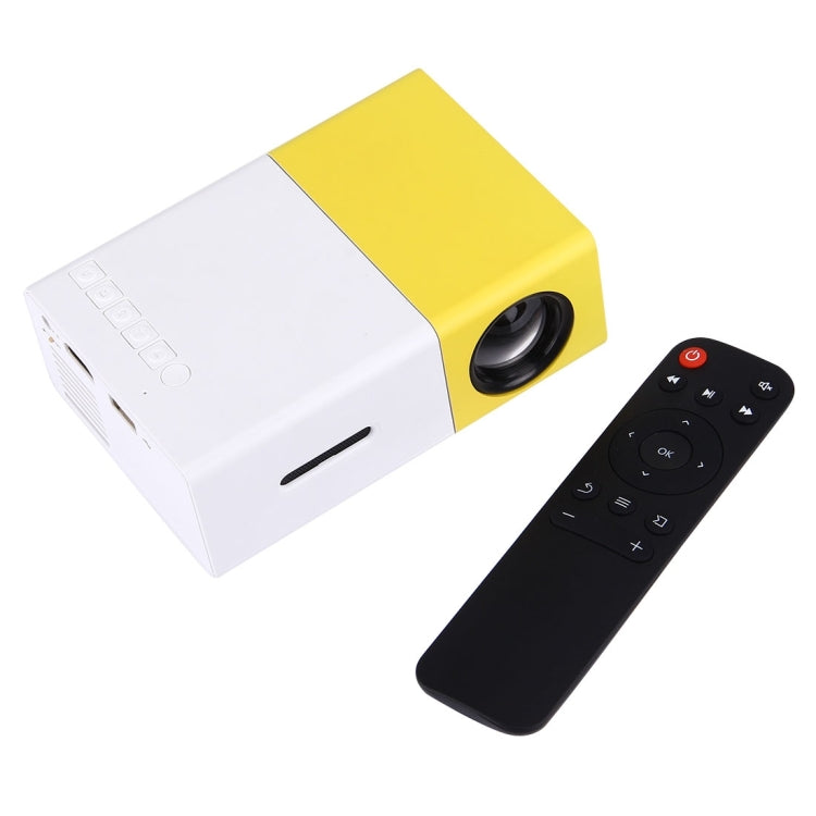YG-300 0.8-2M 24-60 pulgadas 400-600 lúmenes Proyector LED Cine en casa HD con cable de conversión de video 3 en 1 y control remoto, Tamaño: 12.6 x 8.6 x 4.6 cm, Enchufe de la UE