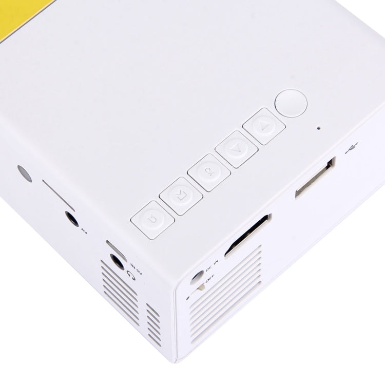 YG-300 0.8-2M 24-60 pulgadas 400-600 lúmenes Proyector LED Cine en casa HD con cable de conversión de video 3 en 1 y control remoto, Tamaño: 12.6 x 8.6 x 4.6 cm, Enchufe de la UE
