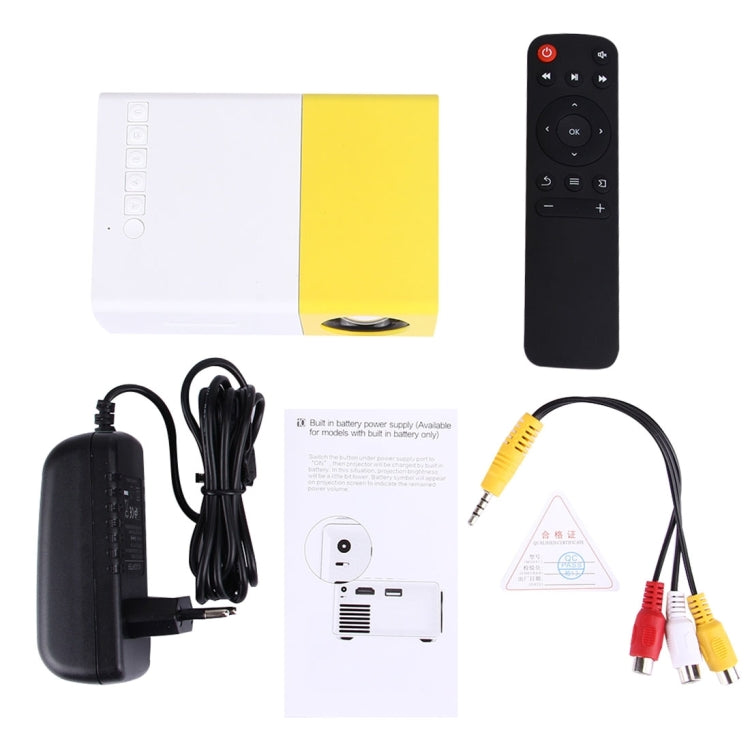 YG-300 0.8-2M 24-60 pulgadas 400-600 lúmenes Proyector LED Cine en casa HD con cable de conversión de video 3 en 1 y control remoto, Tamaño: 12.6 x 8.6 x 4.6 cm, Enchufe de la UE