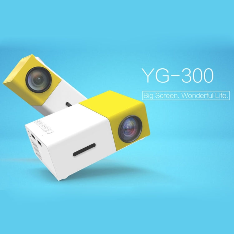 YG-300 0.8-2M 24-60 pulgadas 400-600 lúmenes Proyector LED Cine en casa HD con cable de conversión de video 3 en 1 y control remoto, Tamaño: 12.6 x 8.6 x 4.6 cm, Enchufe de la UE