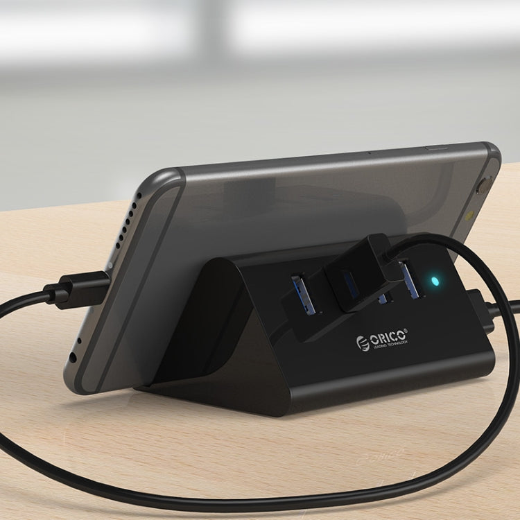 ORICO SHC-U3 HUB USB 3.0 de 4 puertos de escritorio de material ABS con soporte para teléfono/tableta y cable USB de 1 m e indicador LED, SHC-U3
