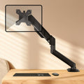 Soporte de escritorio ajustable en altura con resorte cilíndrico y brazo articulado para monitores de 10 a 32 pulgadas., DY-01